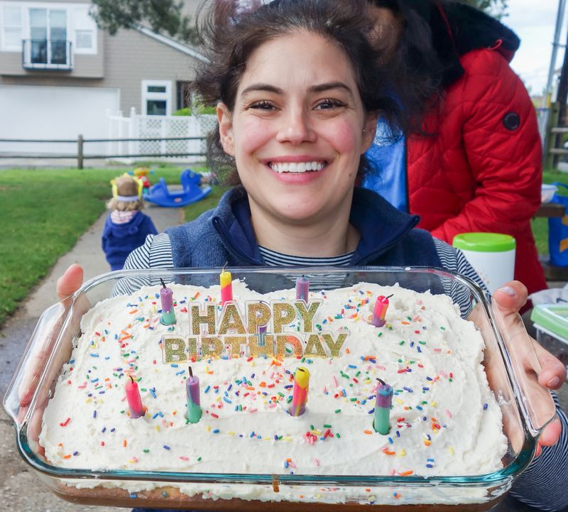 Alexis holding a birthday cake